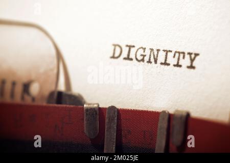 Dignity text written with a typewriter. Stock Photo
