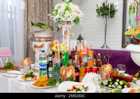 Many different dishes and drinks on the festive table. Delicious dishes on the wedding table in Ukraine Stock Photo