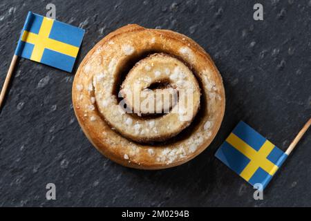 Cinnamon rolls buns on wooden table. Kanelbulle Swedish dessert Stock Photo