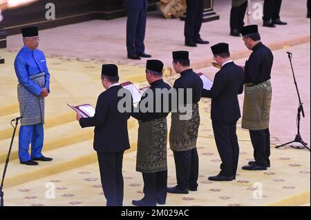 (221203) -- KUALA LUMPUR, Dec. 3, 2022 (Xinhua) -- Malaysian new cabinet ministers are sworn in before Malaysian King Sultan Abdullah Sultan Ahmad Shah (1st, L) in Kuala Lumpur, Malaysia, Dec. 3, 2022. Malaysian cabinet ministers appointed to their portfolios were sworn in on Saturday, allowing them to officially assume their duties. In a televised ceremony, they took their oaths of office in front of Malaysian King Sultan Abdullah Sultan Ahmad Shah, who also presented them with the documents of their appointment. (Malaysia's Department of Information/Handout via Xinhua) Stock Photo