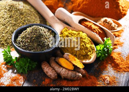 Composition with spices on wooden kitchen table. Stock Photo