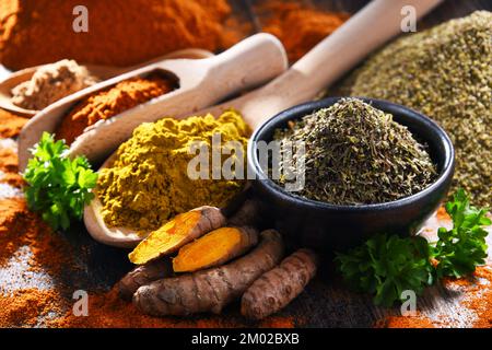 Composition with spices on wooden kitchen table. Stock Photo