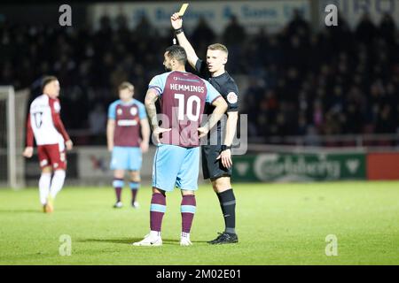 Northampton, UK. 3rd December 2022. Referee Will Finnie shows a yellow card to Tranmere Rovers captain Kane Hemmings during the second half of the Sky Bet League 2 match between Northampton Town and Tranmere Rovers at the PTS Academy Stadium, Northampton on Saturday 3rd December 2022. (Credit: John Cripps | MI News) Credit: MI News & Sport /Alamy Live News Stock Photo