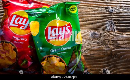 POZNAN, POL - AUG 17, 2022: Packets of Lay's potato chips, popular American brand founded in 1932 and owned by PepsiCo since 1965. Stock Photo