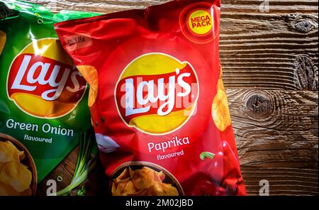 POZNAN, POL - AUG 17, 2022: Packets of Lay's potato chips, popular American brand founded in 1932 and owned by PepsiCo since 1965. Stock Photo