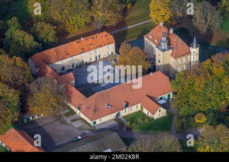 Aerial view, Heeren castle, autumn forest, Heeren-Werve, Kamen, Ruhr area, North Rhine-Westphalia, Germany, Colorful trees, Burg, Trees in autumn colo Stock Photo