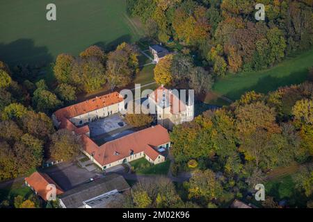 Aerial view, Heeren castle, autumn forest, Heeren-Werve, Kamen, Ruhr area, North Rhine-Westphalia, Germany, Colorful trees, Burg, Trees in autumn colo Stock Photo