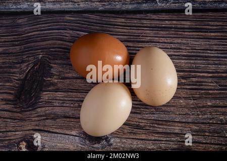 Chicken eggs on a wooden table Stock Photo