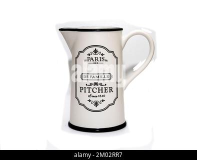 White metal milk pitcher. Isolated on white background. Stock Photo
