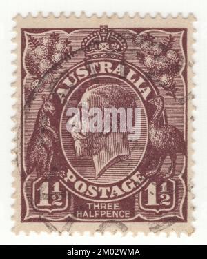 AUSTRALIA — 1918: An 1½ pence chocolate postage stamp showing portrait of King George V (George Frederick Ernest Albert) was King of the United Kingdom and the British Dominions, and Emperor of India, from 6 May 1910 until his death in 1936. Born during the reign of his grandmother Queen Victoria, George was the second son of Albert Edward, Prince of Wales, and was third in the line of succession to the British throne behind his father and his elder brother, Prince Albert Victor Stock Photo
