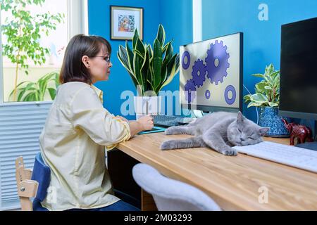Middle aged female graphic designer working from home Stock Photo