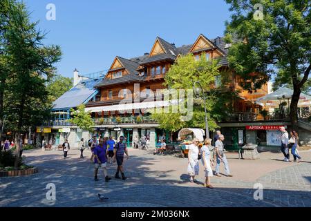 Zakopane, Poland - September 12, 2016: Unidentified tourists walks along Krupowki Street just next to Sabala Hotel which was built as Staszeczkowka in Stock Photo