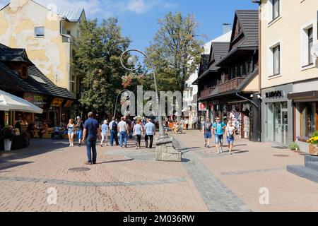 Zakopane, Poland - September 12, 2016: Unidentified tourists walks along Krupowki street that is the most known pedestrian zone and shopping area in t Stock Photo