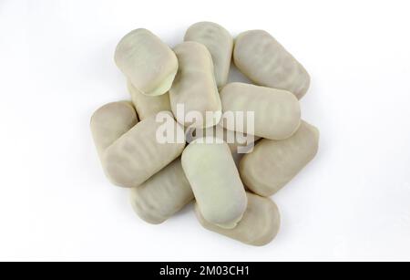 Pile of white chocolate covered wafer biscuit sticks isolated on white background Stock Photo