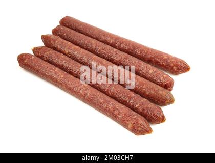 Portion of thin smoked meat sticks isolated on white background Stock Photo