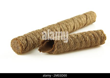 Whole and broken crispy wafer roll sticks filled with chocolate cream isolated on white background Stock Photo