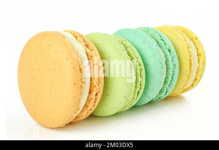 Group of colorful macarons isolated on white background. French traditional dessert macaroons iin four different colours Stock Photo