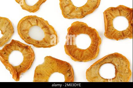 Background pattern of dry japanese kaki apple slices isolated on white Stock Photo