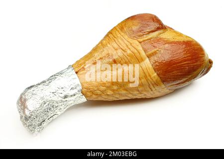 Boiled and smoked turkey leg golden colour isolated on white background Stock Photo