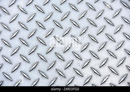 Close-up of shiny steel with texture diamond plate pattern Stock Photo