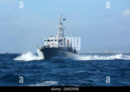 And Italian Coast Guard (Guardia Costiera) navy ship patrolling the Mediterranean waters of the Amalfi Coast, near Sorrento, Campania, Italy. Stock Photo