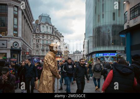 London, December 3rd 2022 - Living statue street artist at Leicester Square Stock Photo