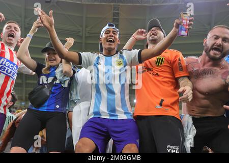 Ar Rayyan, Qatar. 04th Dec, 2022. Argentine supporters celebrate during the FIFA World Cup Qatar 2022 round of 16 match between Argentina and Australia at Ahmad Bin Ali Stadium, Ar-Rayyan, Qatar on 3 December 2022. Photo by Peter Dovgan. Editorial use only, license required for commercial use. No use in betting, games or a single club/league/player publications. Credit: UK Sports Pics Ltd/Alamy Live News Stock Photo