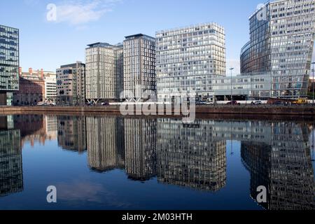New residential and office blocks reflected in the water, the waterfront at the Royal Albert Dock, Liverpool Liverpool Docks UK Stock Photo