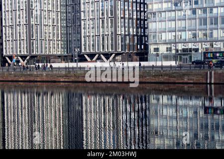 New residential and office blocks reflected in the water, the waterfront at the Royal Albert Dock, Liverpool Liverpool Docks UK Stock Photo