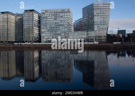 New residential and office blocks reflected in the water, the waterfront at the Royal Albert Dock, Liverpool Liverpool Docks UK Stock Photo