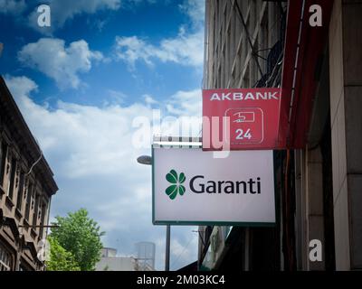 Picture of signs with the logos of Akbank and Garanti BBVA taken in front of their local banks in Istanbul, Turkey. Akbank T.A.Ş. is one of the larges Stock Photo