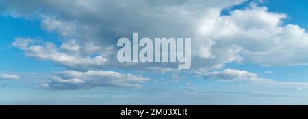 Beautiful blue sky with some clouds during summer on a nice day Stock Photo