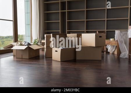 Heap of paper boxes for moving stacked on floor Stock Photo