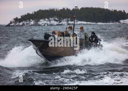 Baltic Sea. 25th Nov, 2022. U.S. Marines with Combat Logistics Battalion 6, Combat Logistics Regiment 2, 2nd Marine Logistics Group, drive a Finnish G-Class landing craft while operating the Amy, an unmanned surface vehicle on the Baltic Sea, off the coast of Finland Nov. 25, 2022. Task Force Red Cloud, headquartered by elements of CLB-6, is deployed to Finland in support of Exercises SYD 2022 and Freezing Winds 2022 to enhance U.S. and Finnish select interdependence in the maritime domain; solidify bilateral maritime maneuver within the Finnish littoral environment; and foster strong rel Stock Photo