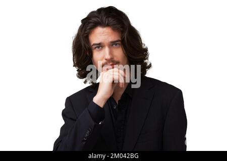 Dark, handsome and mysterious. Handsome young man posing with his hand on his chin - isolated. Stock Photo