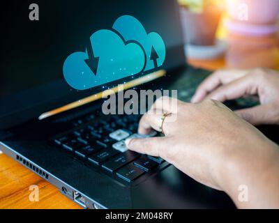 Human hand working on computer and cloud icon. Cloud computing concept, connect communication equipment  information and technology with cloud computi Stock Photo