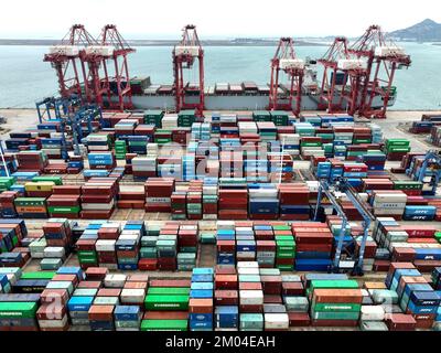 LIANYUNGANG, CHINA - DECEMBER 7, 2022 - Cargo ships dock at their ...