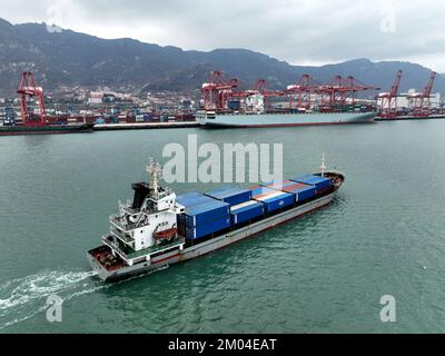 LIANYUNGANG, CHINA - DECEMBER 7, 2022 - Cargo ships dock at their ...