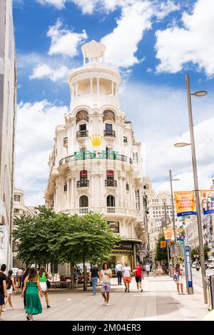 Madrid, Spain - June 20, 2022: Corner of the Grassy building, home to the Rolex store, on the Gran Via in Madrid Stock Photo