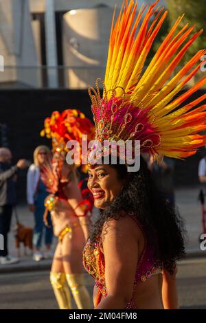 Liverpool, UK: Dancer in headdress at Brazilica parade and samba carnival. Stock Photo