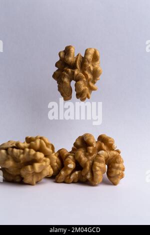 dry peeled walnut on white background Stock Photo