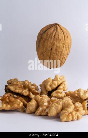 walnuts suspended in the air on a white background Stock Photo