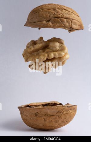 walnuts suspended in the air on a white background Stock Photo