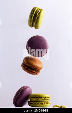 macaroons suspended in the air on a white background Stock Photo