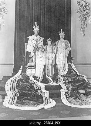 Royal family of England. Picture taken at Westminster Abbey during the day of the coronation of King George VI and Queen Elizabeth may 12 1937. Pictured together with their daughters Princess Margaret and Princess Elizabeth. Stock Photo