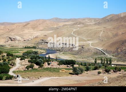 The Hari River (Harirud) near Chisht-e-Sharif in Herat Province, Afghanistan. The river flows past a small village in this remote part of Afghanistan. Stock Photo