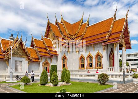 Bangkok, Thailand - Dec 4, 2022 : Tourists visiting Wat Benchamabophit Dusitvanaram (also known as the Marble Temple), a major destination in Bangkok. Stock Photo