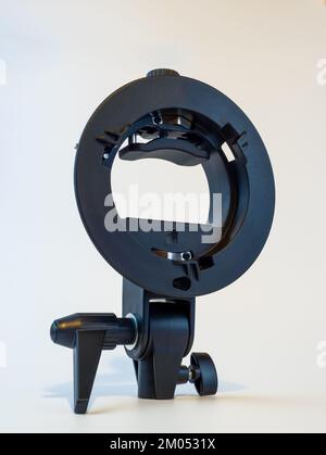 Generic Black S Type Speedlight bracket  isolated on a white background Stock Photo