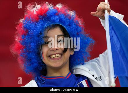 Doha, Qatar. 4th Dec, 2022. A fan cheers prior to the Round of 16 match between France and Poland of the 2022 FIFA World Cup at Al Thumama Stadium in Doha, Qatar, Dec. 4, 2022. Credit: Xiao Yijiu/Xinhua/Alamy Live News Stock Photo