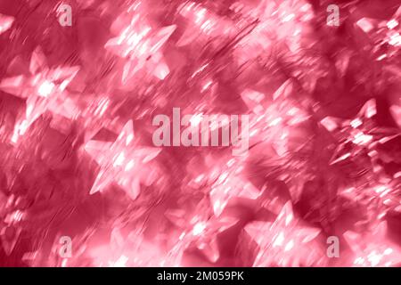 Abstract blurred luminous background of star shaped neon lights in motion during long exposure. Photographic effect. Trendy toning in color 2023 Viva Stock Photo
